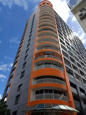 a large tall building with an orange at 32Sqm 1000x500wifi workplace long stay in Amphoe Phra Khanong