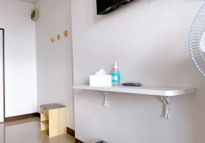 a white shelf on a wall with a bottle on it at 32Sqm 1000x500wifi workplace long stay in Amphoe Phra Khanong