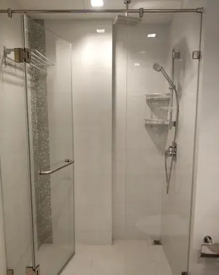 a shower with a glass door in a bathroom at Sathon Luxury High-rise Apartment City View KingPower ,IconSiam ,BNH,Silom in Bangkok
