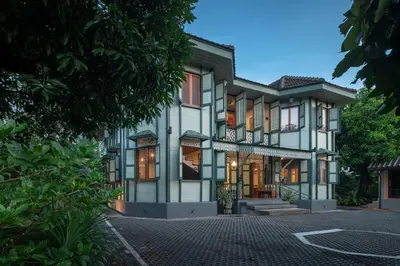 a house with white and green trim at neil niwas in Bangkok