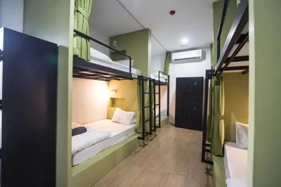 a room with two bunk beds and a hallway at All day hostel at BTS Bang Chak in Bangkok