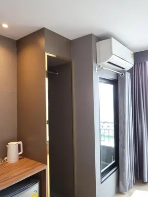 a room with a door and a window and a room at S3 Siam Bangkok Hotel in Bangkok