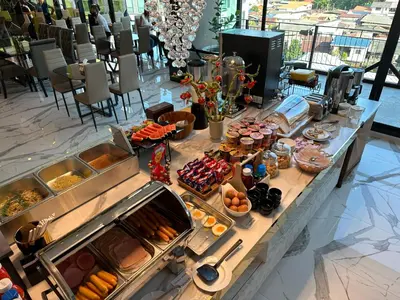 a buffet line with many different types of food at S3 Siam Bangkok Hotel in Bangkok