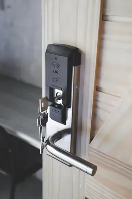 a lock on a door with a key on it at The Cube Hostel Khaosan in Bangkok
