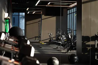 a gym with bikes parked in a room at SILQ Hotel & Residence in Bangkok
