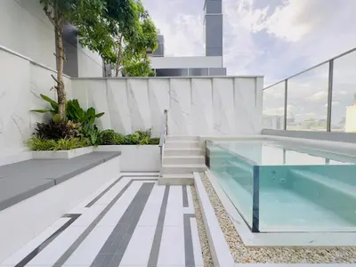 a swimming pool on the roof of a house at SILQ Hotel & Residence in Bangkok