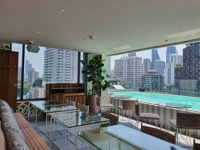a view of a swimming pool from a building at Public House Bangkok, a Member of Design Hotels in Bangkok