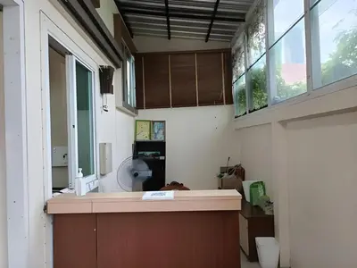 a kitchen with a counter with a sink and a window at Grandview Place in Bangkok