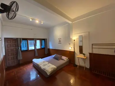 a bedroom with a bed in a room at Freedom8 in Khlong San