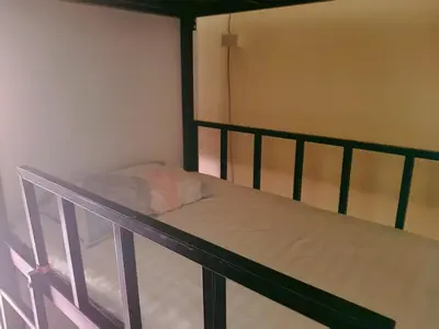 a bunk bed in a small room with at \u66fc\u8c37\u8d75\u5c0f\u59d0\u7684\u5e97MissZhaoHostel in Bangkok