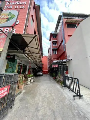 an empty street in a city with buildings at Ratanawong Place 511 in Bangkok
