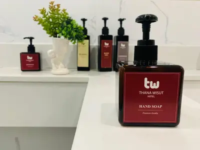 a bottle of hair soap sitting on a counter at Thana Wisut Hotel in Bangkok