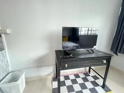 a black dresser with a mirror on top of it at Lively Impact C3-C9 in Nonthaburi