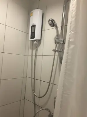 a shower in a bathroom with a shower head at xx GO INN Khaosan Road - โก อินน์ ตรอกข้าวสาร in Bangkok