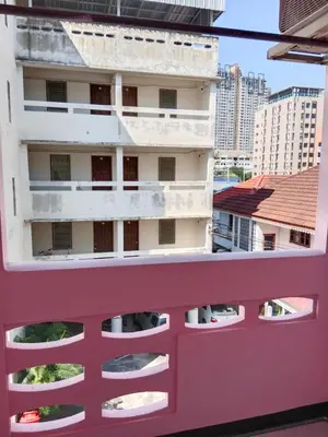 a view of a building from a balcony at Worakarn Apartment 1 in Bangkok