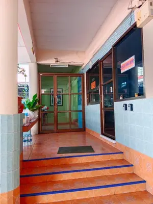 an entrance to a building with a glass door at Worakarn Apartment 1 in Bangkok