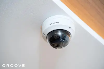 a security camera on a door knob on a door at GROOVE AT SIAM in Pom Prap