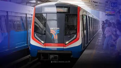a subway train pulling into a station with people on the platform at GROOVE AT SIAM in Pom Prap