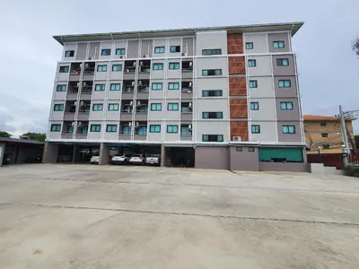 a large white building with a lot of windows at Siam Rama9 Hotel in Amphoe Phra Khanong