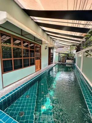 a swimming pool in the middle of a house at T-House BKK 2Floors near BTS with swimming pool and free Wifi in Khlong Toei