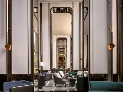 a hallway with couches and chairs in a building at InterContinental Bangkok Sukhumvit by IHG in Bangkok