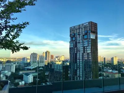a view of a city skyline with a tall building at Rhythm sukhumvit 36 two bedrooms in Bangkok