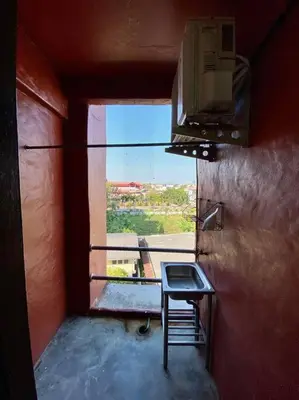 a small room with a table and a window at Ratanawong Place 406 in Bangkok
