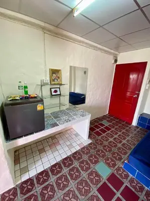 a room with a red door and a tile floor at Ratanawong Place 404 in Bangkok