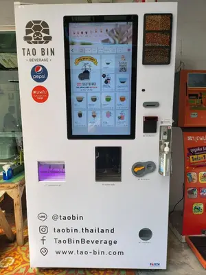a sign for a tao bim machine in a store at Ratanawong Place 404 in Bangkok