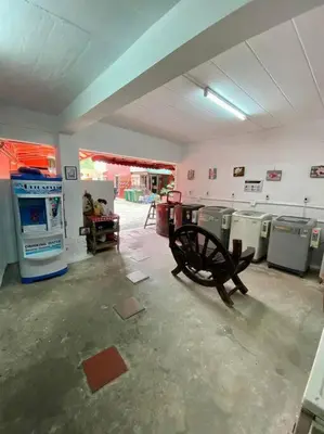 a room with a bunch of old machines in it at Ratanawong Place 404 in Bangkok