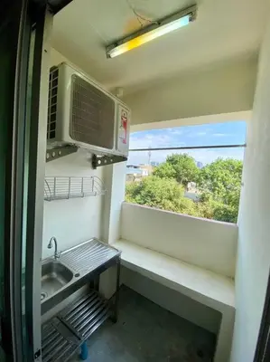 a small kitchen with a sink and a window at Ratanawong Place 823 in Bangkok