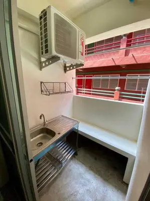 a small bathroom with a sink and a window at Ratanawong Place 801 in Bangkok