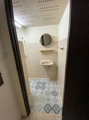 a small bathroom with a sink and a toilet at Ratanawong Place 334 in Bangkok