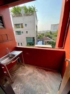 a view of a balcony with a sink and a building at Ratanawong Place 560 in Bangkok