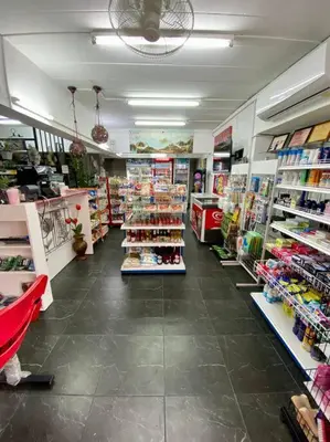 a store aisle with a lot of products on display at Ratanawong Place 510 in Bangkok