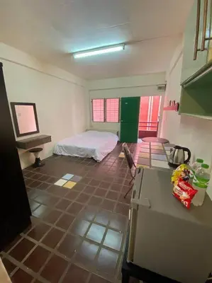 a room with a kitchen with a bed in it at Ratanawong Place 516 in Bangkok