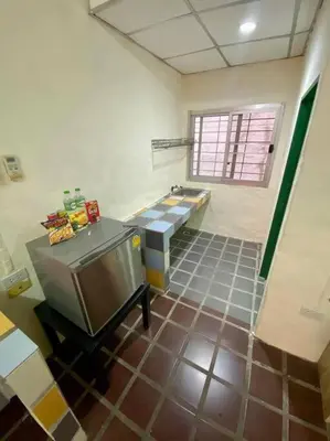 a bathroom with a sink and a toilet and a counter at Ratanawong Place 514 in Bangkok