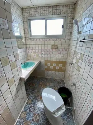 a bathroom with a toilet and a sink and a tub at Ratanawong Place 401 in Bangkok