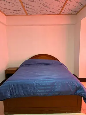 a bedroom with a bed with a purple ceiling at My Hotel Bangkok Noi in Bangkok Noi