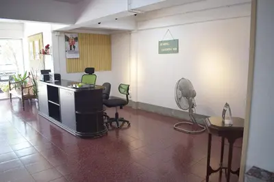 a room with a hair salon with chairs and a fan at My Hotel Bangkok Noi in Bangkok Noi