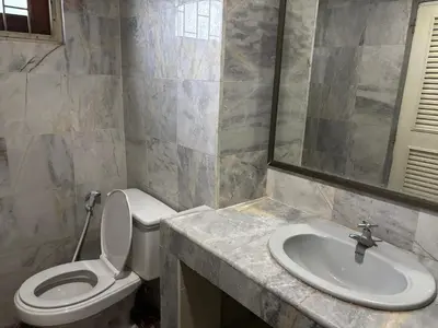 a bathroom with a toilet and a sink at My Hotel Bangkok Noi in Bangkok Noi