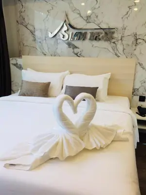two swans making a heart on a bed at Siam Best Inn in Makkasan