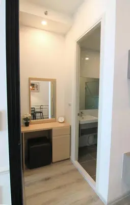 a bathroom with a desk with a mirror and a sink at New Condo, Hi-Speed Wi-Fi, Gym Pool, near Lam Sali MRT in Bangkok