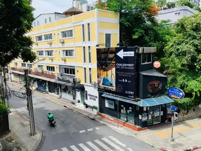 an overhead view of a street with a building at Thonglor Suites Hotel in Bangkok