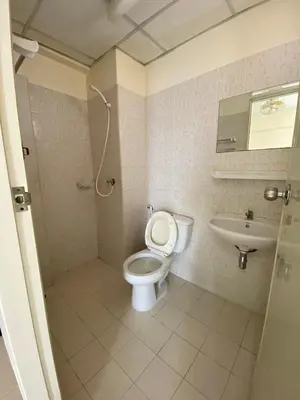 a bathroom with a toilet and a sink at My Space 77 in Ban Khlong Khwang Klang