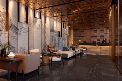 a lobby with couches and chairs in a building at dusitD2 Samyan Bangkok in Bangkok