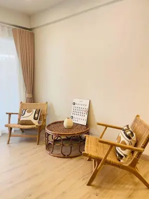 a living room with two chairs and a table at BKK Villa/Huaikwang China Twon in Bangkok