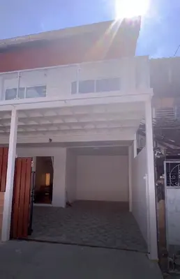a view of a white house with a balcony at BKK Villa/Huaikwang China Twon in Bangkok