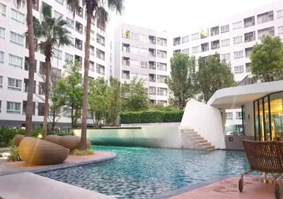 a swimming pool in the middle of a building at Elio Del Ray in Bangkok