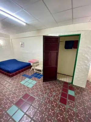 a room with a room with a bed and tiled floors at Ratanawong Place 206 in Bangkok